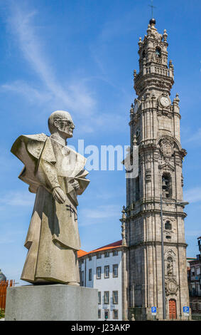 Portugal, Region Norte, Porto, statue of António Ferreira Gomes the former bishop of Porto oposite the monumental Baroque bell tower of Clérigos Churc Stock Photo
