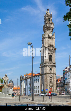 Portugal, Region Norte, Porto, statue of António Ferreira Gomes the former bishop of Porto oposite the monumental Baroque bell tower of Clérigos Churc Stock Photo