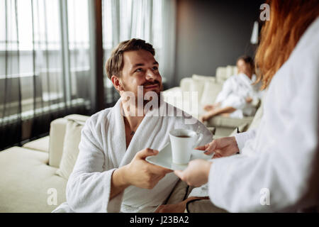 Handsome man drinking tea in morning resting room Stock Photo