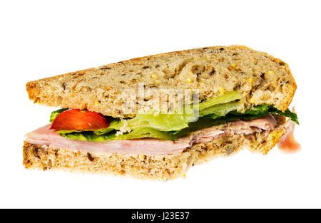 Ham sandwich half eaten with a bite out of one corner Stock Photo