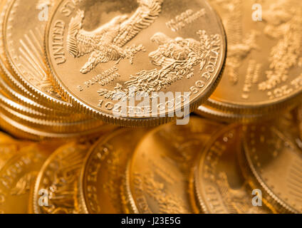 Stacks of American gold eagle one troy ounce golden coins from US Treasury mint Stock Photo