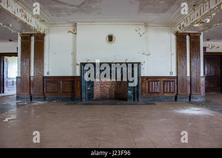 HAUNTING images from inside one of America’s top spots for ghost-hunters who claim to see a young glowing girl dressed in white staring out of the windows of this abandoned asylum.  The psychiatric hospital appeared under a false name on MTV’s hit show Fear which saw contestants spend a weekend at various haunted locations around the country.  These eerie photographs were taken by urban explorer Drew Thomas Scavello (27) at the Fairfield Hills State Hospital in Newtown, Connecticut.  “When I was ten-years-old an MTV Show called Fear was filmed at the hospital,” said Drew.  “The episode intrigu Stock Photo