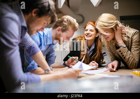 Group of creative designers brainstorming and working on a project Stock Photo