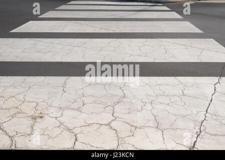 Pattern of the old crosswalks on the road. Stock Photo