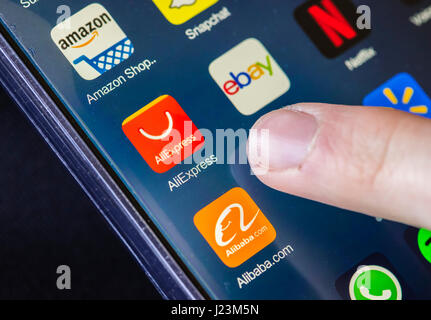 Zurich, Switzerland - 19 February 2017: The icons of AliExpress, Alibaba.com, Ebay and Amazon online shopping apps on a smartphone's touchscreen. Stock Photo