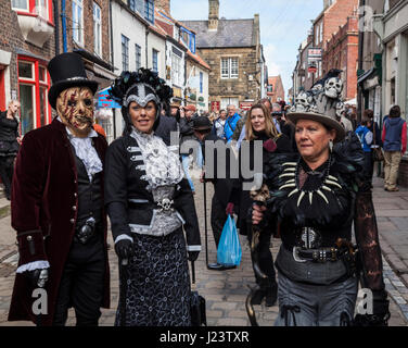 Two women and a man dressed up for the Goth Weekend in Whitby,North Yorkshire,England,UK.Steampunks,Goths Stock Photo