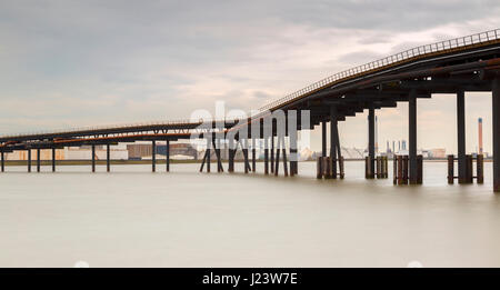 Disused Oil Jetty Across Holehaven Creek Formerly Used to connect Unloading Berths to Storage on Canvey Island Stock Photo