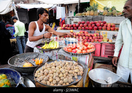 Jodhpur, India, september 10, 2010: Young men selling vegetables and fruits on a localstreet market in Udaipur. Stock Photo