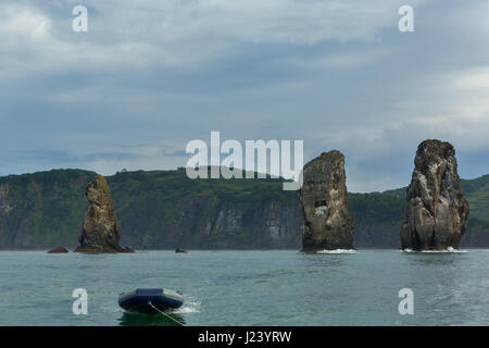 Three Brothers Rocks in the Avacha Bay of Pacific Ocean. Coast of Kamchatka. Stock Photo