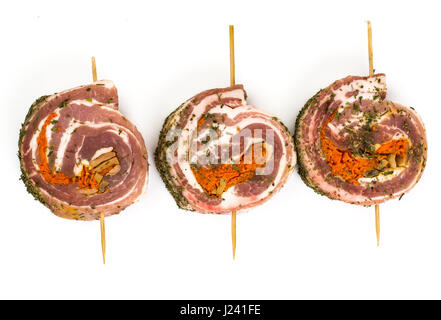 Raw meat rolls on wooden skewers for frying. Studio Photo Stock Photo