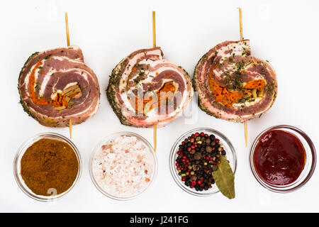 Raw meat rolls on wooden skewers for frying. Studio Photo Stock Photo
