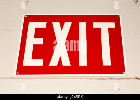 Exit Sign on White Wood Paneling Stock Photo
