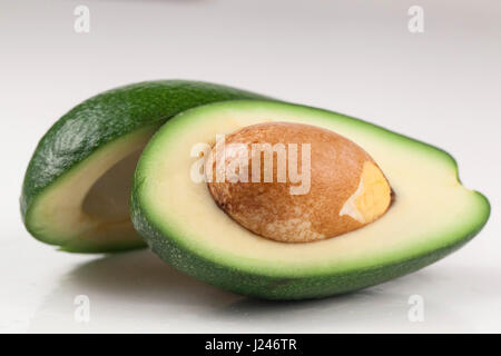 Fresh Cut Avocado With Heart Shaped Pit Area On Wooden Cutting Board  16444609 Stock Photo at Vecteezy