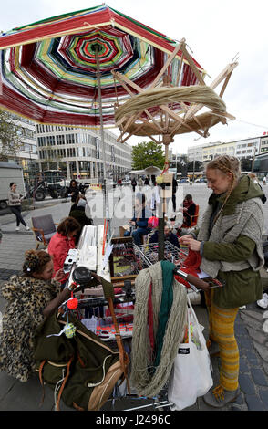 Hanover, Germany. 24th Apr, 2017. Fashion students with a so-called wollator, a mobile knitting station, on the street in Hanover, Germany, 24 April 2017. The students are marking Fashion Revolution Day with a demonstration against mindless consumption. Photo: Holger Hollemann/dpa/Alamy Live News Stock Photo