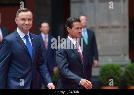 Mexico City, Mexico. 24th April, 2017. Mexican President Enrique Pena Nieto, left, escorts Polish President Andrzej Duda for a review of the honor guard during the formal arrival ceremony at the national palace April 24, 2017 in Mexico City, Mexico. Credit: Planetpix/Alamy Live News Stock Photo