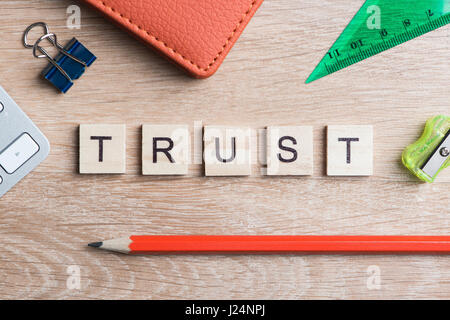 Elements of game with letters spelling business keywords on workplace ...