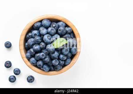 Bowl of fresh blueberries isolated on white, top view copy space Stock Photo