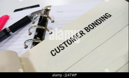 Customer bonding printed on a white book Stock Photo
