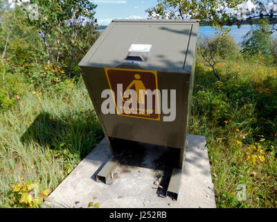 Bear Proof Garbage Container By Lake. Stock Photo