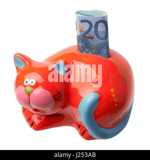 Red piggy bank in the form of a cat with an inserted banknote in 20 euros.  Piggybank is isolated on white background Stock Photo