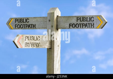 Public Footpath and Public Byway sign against blue sky. Public Footpath and Public Byway sign against blue sky.