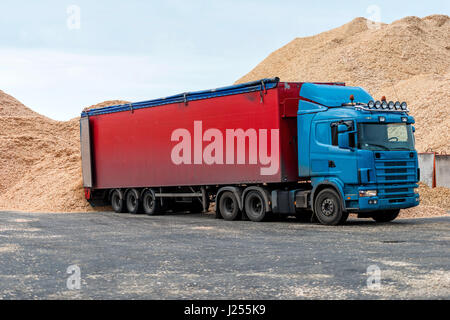 Riga, Latvia - September 25, 2016: The Port of Riga. Truck warehouse place landed in sawdust loads. Stock Photo
