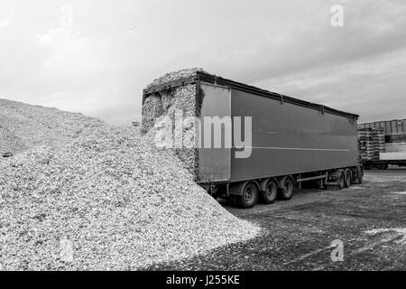 Truck warehouse place landed in sawdust loads. Stock Photo