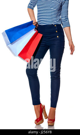 Shopping. The French way. Closeup on modern woman with shopping bags of the colours of the French flag isolated on white Stock Photo
