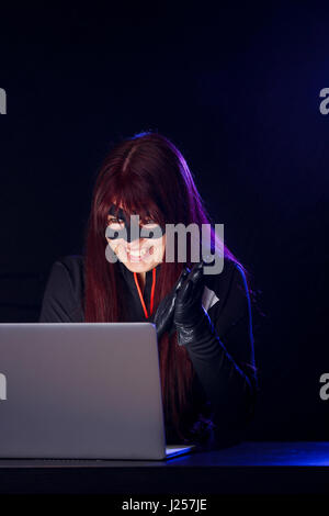 Night photo of hacker girl Stock Photo