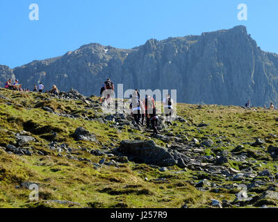 People hiking up to Scafell Pike in the Lade District, Cumbria, England's highest mountain.