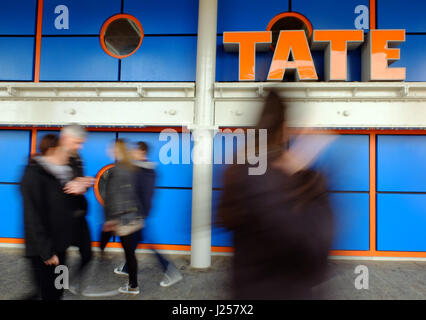 People walking past the Tate Liverpool, in Albert Dock. Stock Photo