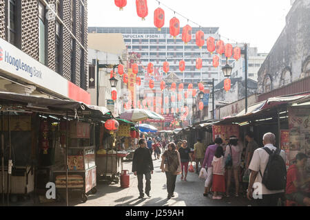 People walk down Jalan Hang Lekir in Chinatown, Kuala Lumpur, Malaysia Stock Photo