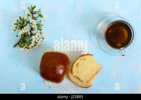 A cup of tea with a soft bun,  is a good start to the day. Breakfast. The top view Stock Photo