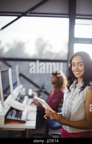 Portrait of female sound engineer in studio using digital tablet in studio Stock Photo