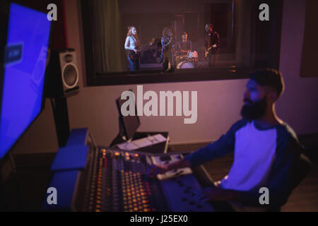 Music composer recording music in the studio Stock Photo
