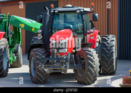 Brakne Hoby, Sweden - April 22, 2017: Documentary of small public farmers day. Red Massey Ferguson 7718 tractor with double rear tires. Stock Photo