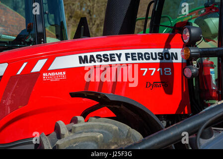 Brakne Hoby, Sweden - April 22, 2017: Documentary of small public farmers day. Massey Ferguson logo on hood of red tractor. Stock Photo