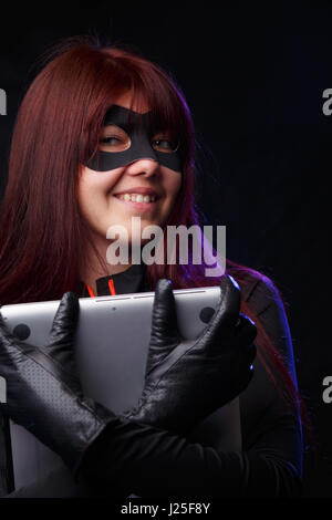 Beautiful thief in black gloves Stock Photo
