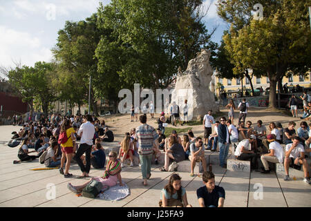 People watching the sunset on a public terrace in Lisbon, Portugal. Stock Photo