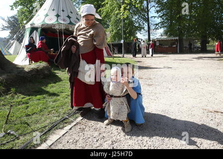 People in costume and items for sale at a medieval fair Stock Photo - Alamy