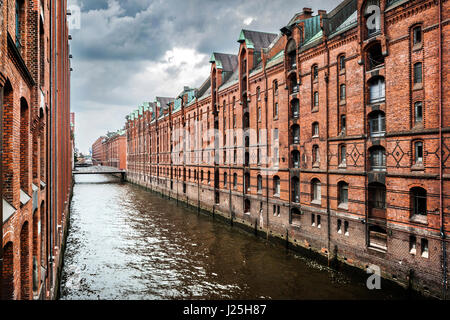 Panoramic view of famous Speicherstadt with dark clouds before the storm in Hamburg, Germany