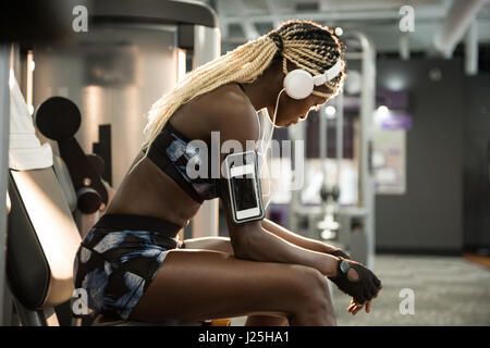 Fit woman taking a break in the gym Stock Photo