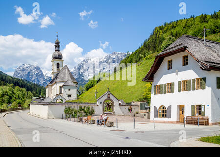 Panoramic view of idyllic Ramsau mountain village with famous Parish Church of St. Sebastian in the Bavarian Alps in springtime, Nationalpark Berchtes Stock Photo