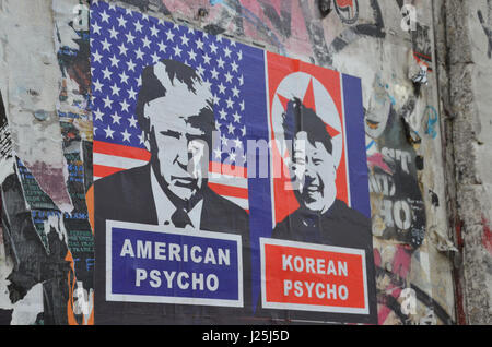A poster depicting Donald Trump and Kim Jong-Un on Brick Lane (Shoreditch, London, UK. 22 April 2017. Credit: Robert Smith/Alamy) Stock Photo