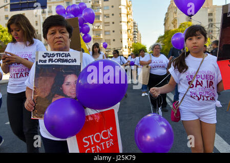 Thousands of women wave banners as they protest violence against women on International Day for the Elimination of Violence against Women in Buenos Aires on November 25, 2016. Stock Photo