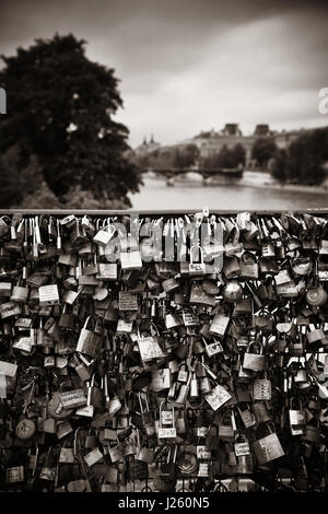 Huge amount of padlocks on bridge over River Seine in Paris Stock Photo