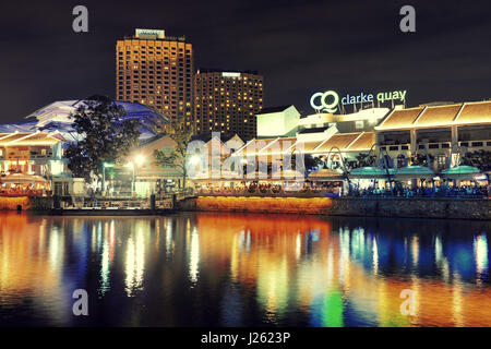 SINGAPORE - APR 5: Clarke Quay at night with street view and restaurant on April 5, 2013 in Singapore. As a historical riverside quay, it is now the h Stock Photo