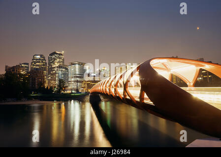 Calgary cityscape with Peace Bridge and downtown skyscrapers in Alberta at night, Canada. Stock Photo