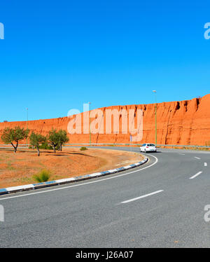 Car on a road circle in the bright sunny day Stock Photo