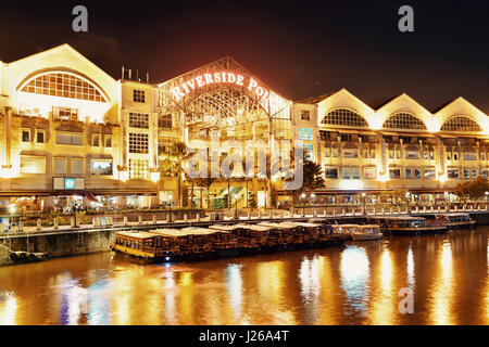 SINGAPORE - APR 5: Clarke Quay at night with street view and restaurant on April 5, 2013 in Singapore. As a historical riverside quay, it is now the h Stock Photo